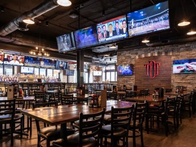 Downtown District Tap Bar Seating and Overhead TVs