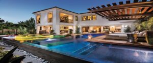 Outdoor lighting and audio visual next to a luxury pool