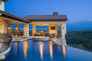 Outdoor lighting and audio visual next to a luxury pool